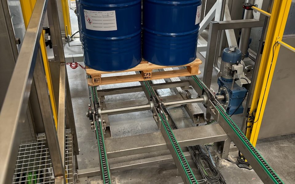 Pallet of drums on the SP3 weighing conveyor